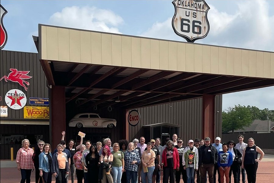 A tour group outside of a Route 66 stop.