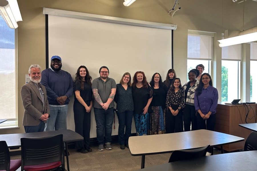 O U city planning students pose with professor and non-profit director.
