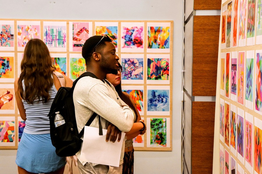 People looking at an art exhibit. 