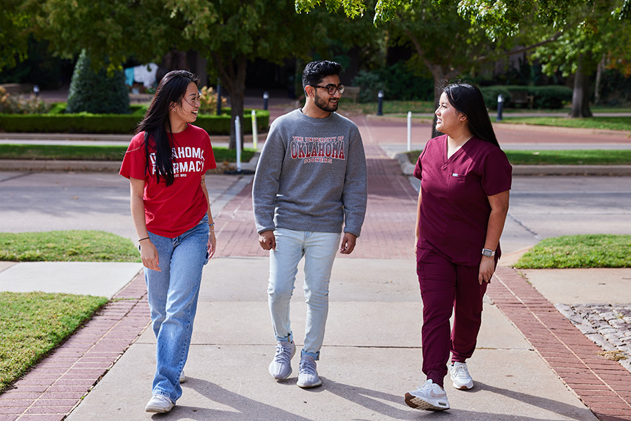 O-U Health students walking down the sidewalk at the Health Campus in Oklahoma City.