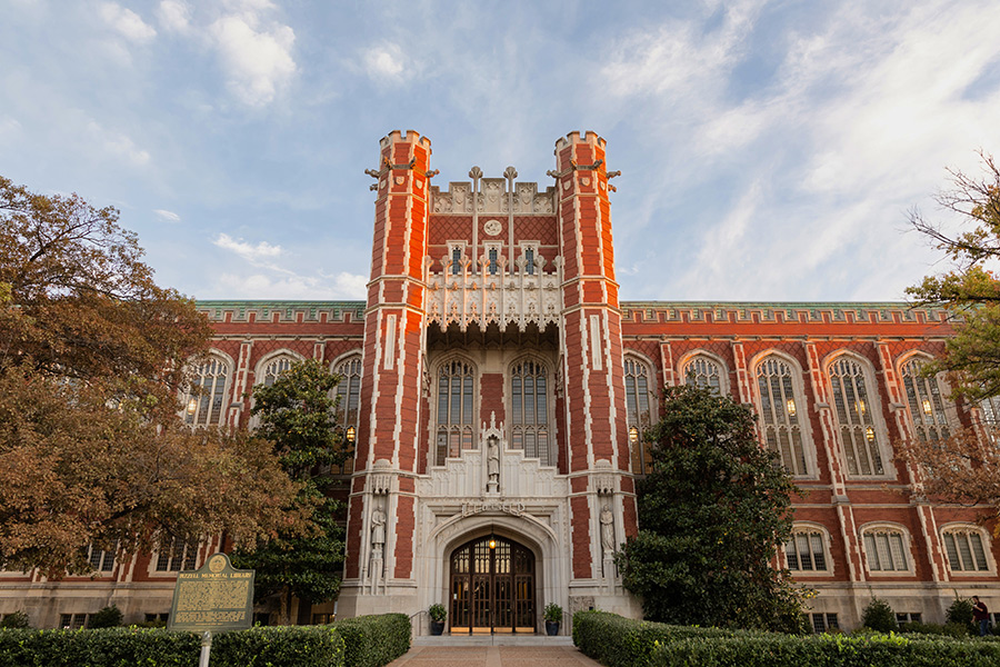 The front of the Bizzell Memorial Library at sunset.