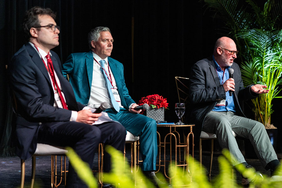 Four Speakers Sitting on Stage for Teach In Event
