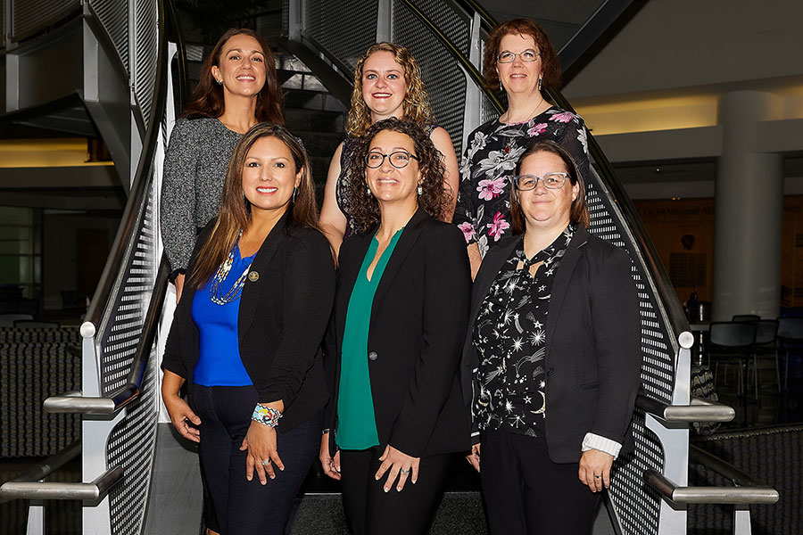 The research team stands on the stairs of the National Weather Center.