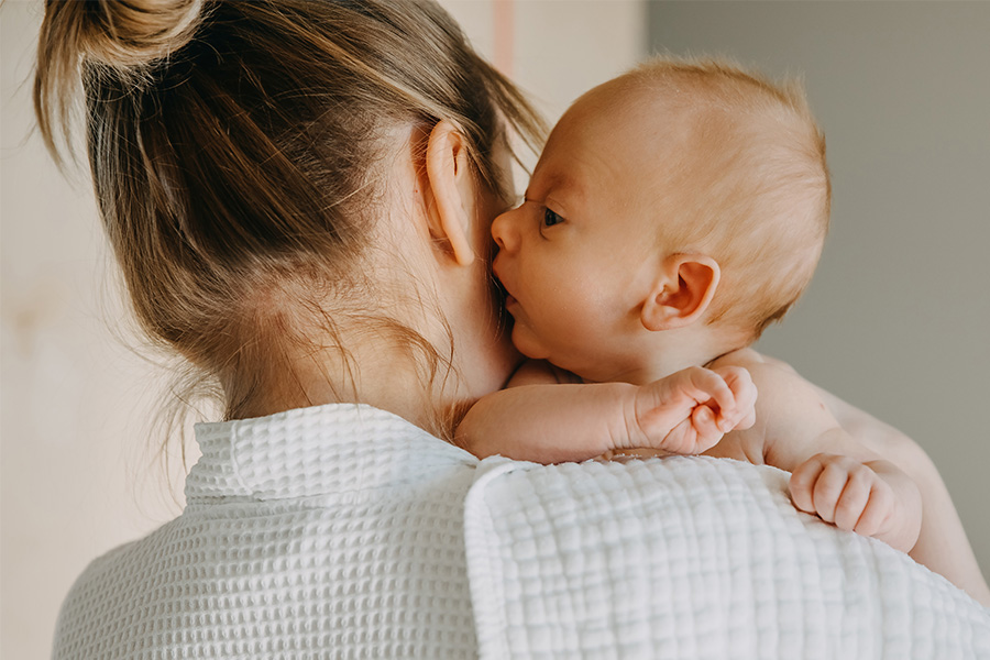 Parent holding a child.