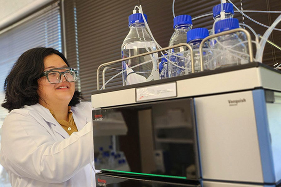 A student working with equipment in the laboratory.