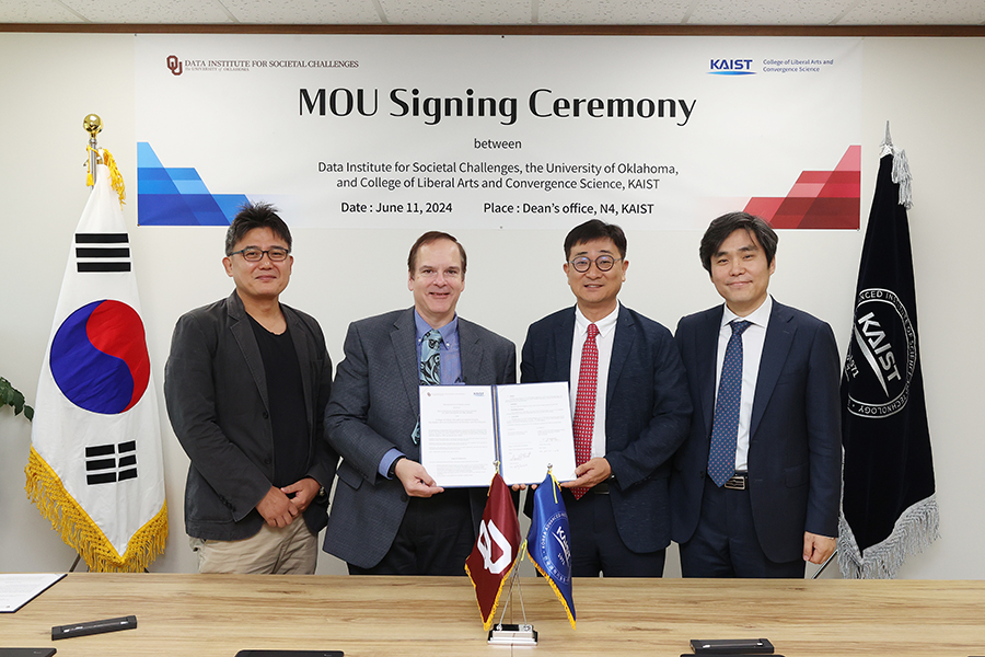 Representatives from OU and KAIST sign an MOU.