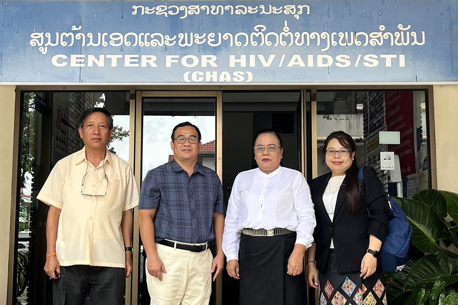 Bui with leaders from the Lao National Center for HIV/AIDS and STI.