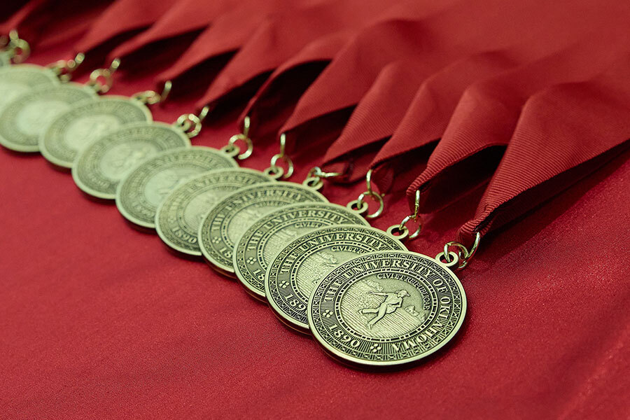 4.0 medallions on red table.