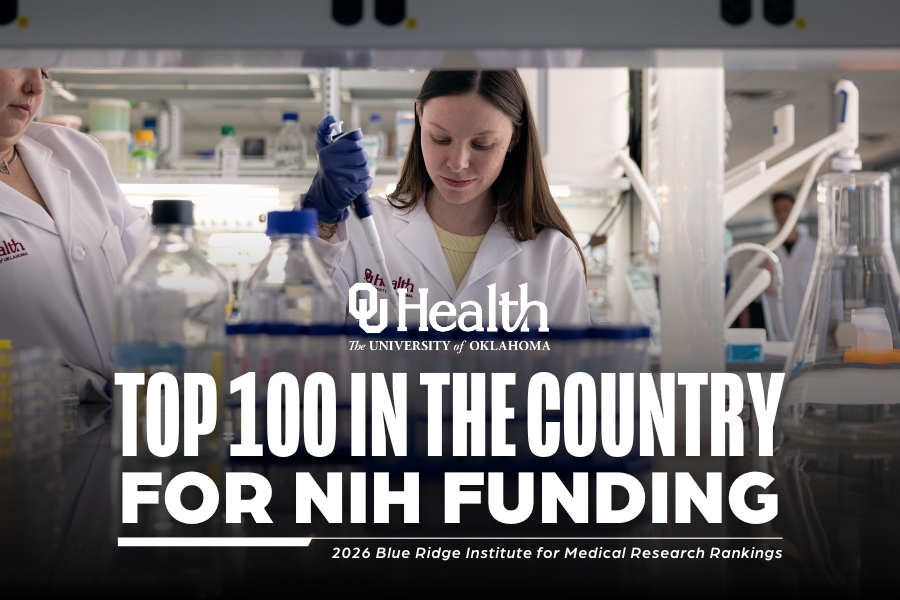 An image of a person in a lab with the words "Top 100 in the County from NIH Funding" on it.