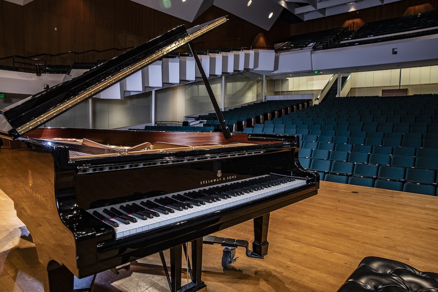 A Steinway piano on a stage. 