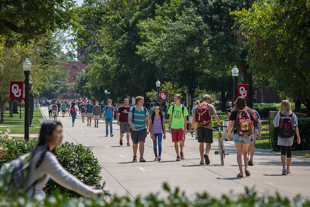 Student walking on the South Oval on the University of Oklahoma campus