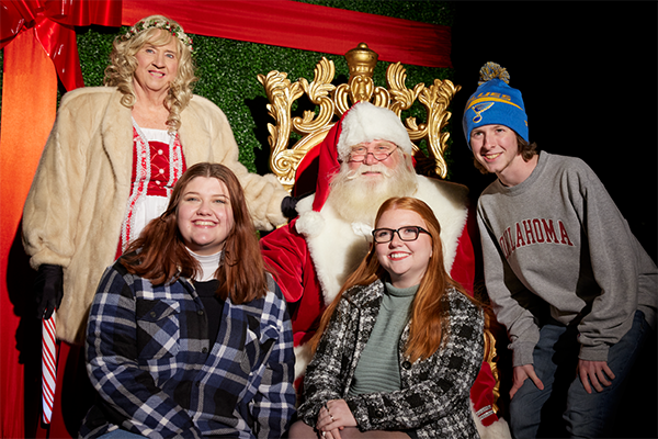 Santa and Mrs. Claus with OU students during 2022 Holiday Lights