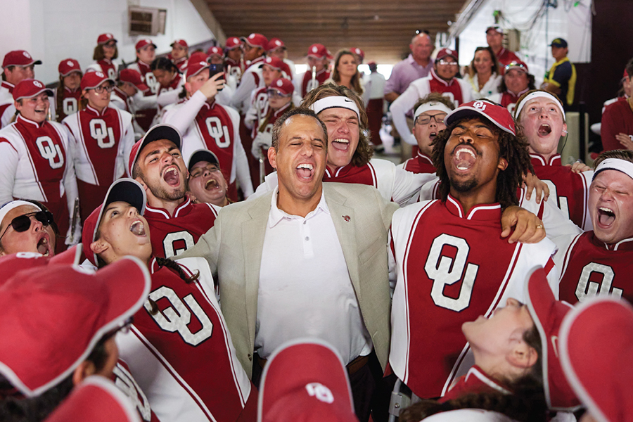OU President, Joe Harroz, singing with the Pride of Oklahoma marching band in the tunnel of an OU football game.