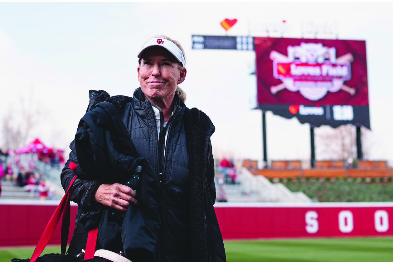 OU Softball Coach, Patty Gasso, walking on field at OU's new Love's Field during opening weekend for new stadium.