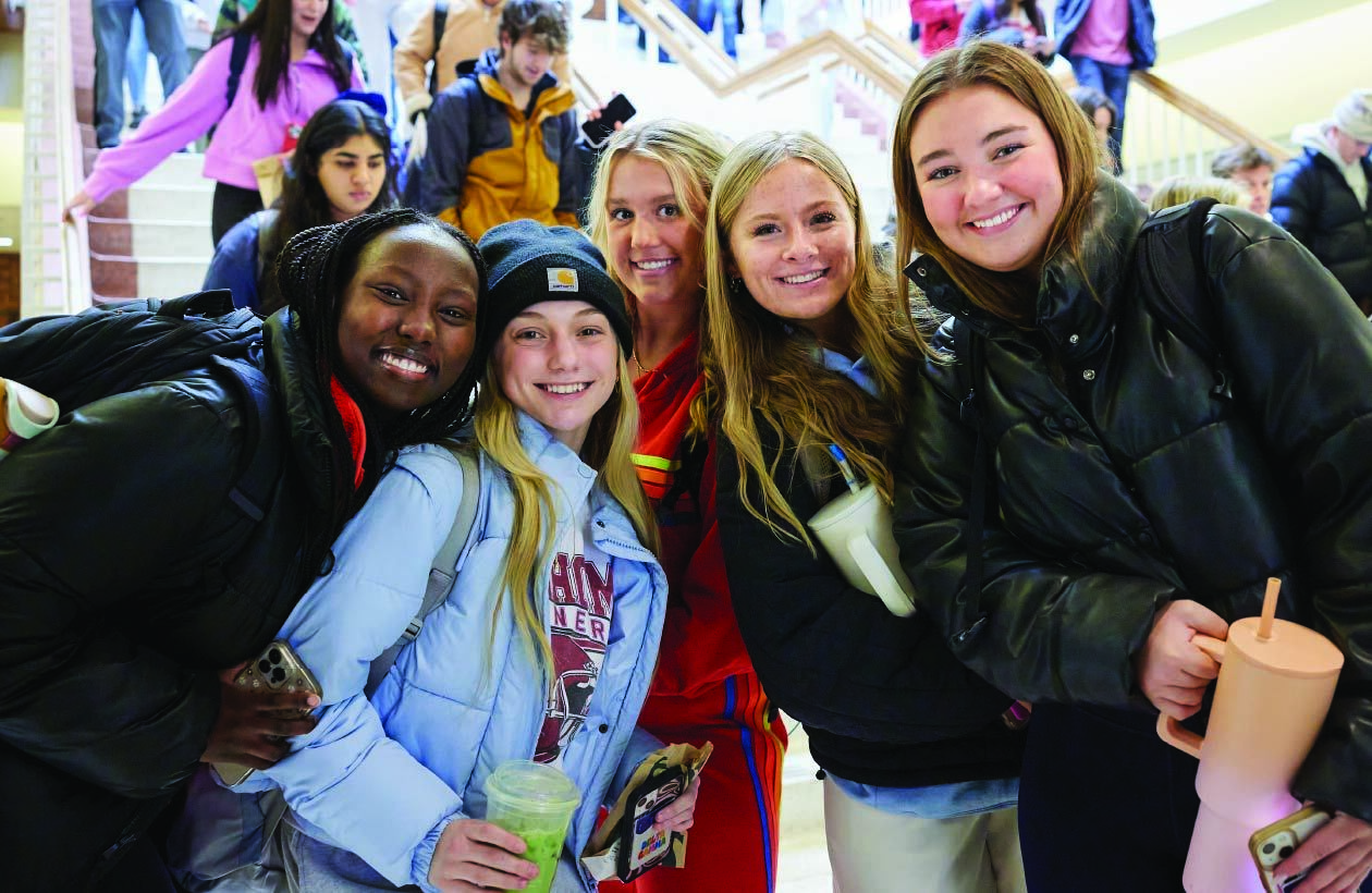 Students smiling on OU Norman Campus during Winter Howdy Week 2024.