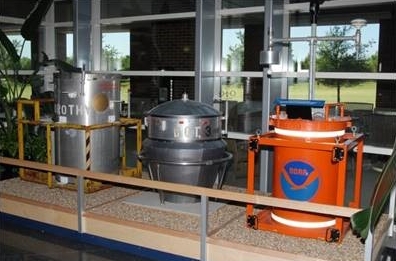 Dorothy, D.O.T., and Toto movie props and NOAA field equipment in the National Weather Center Atrium.