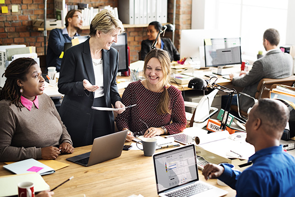 A group of people working in an office setting.