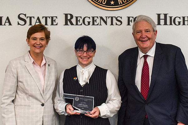 Kara Stanley with award and members of the State Regents.