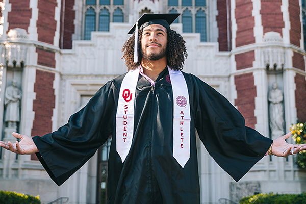 Caleb Kelly in Graduation Regalia