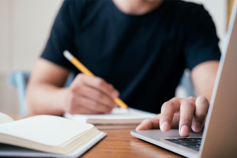 Student working at a laptop