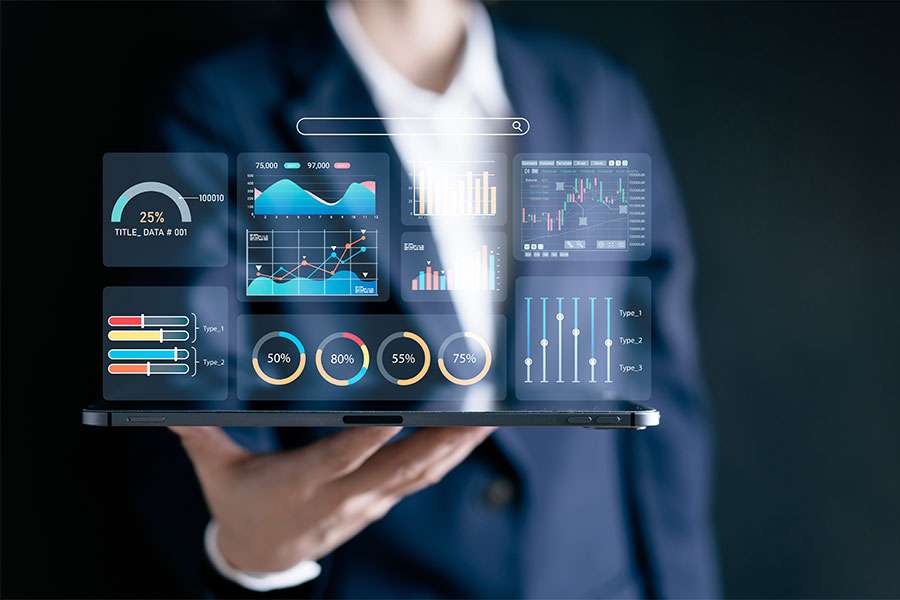 a person in a business suit holding a tablet with a report dashboard showing charts and graphs.
