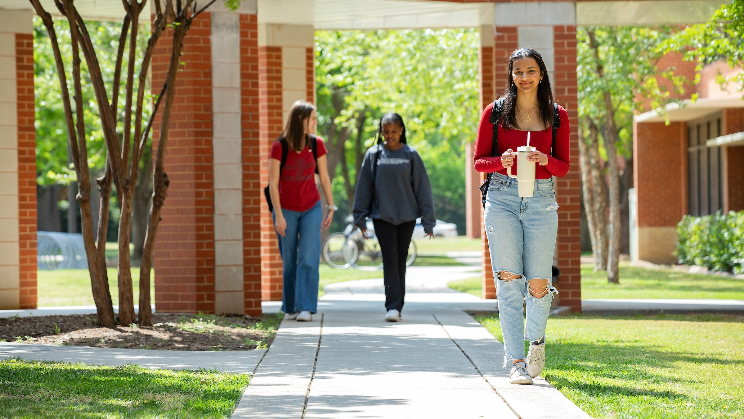 Simon Hurst Photos

Staged.

day daytime

campus

Students walking outside Honors College.

Sunny

sidewalk

trees with green leaves canopy