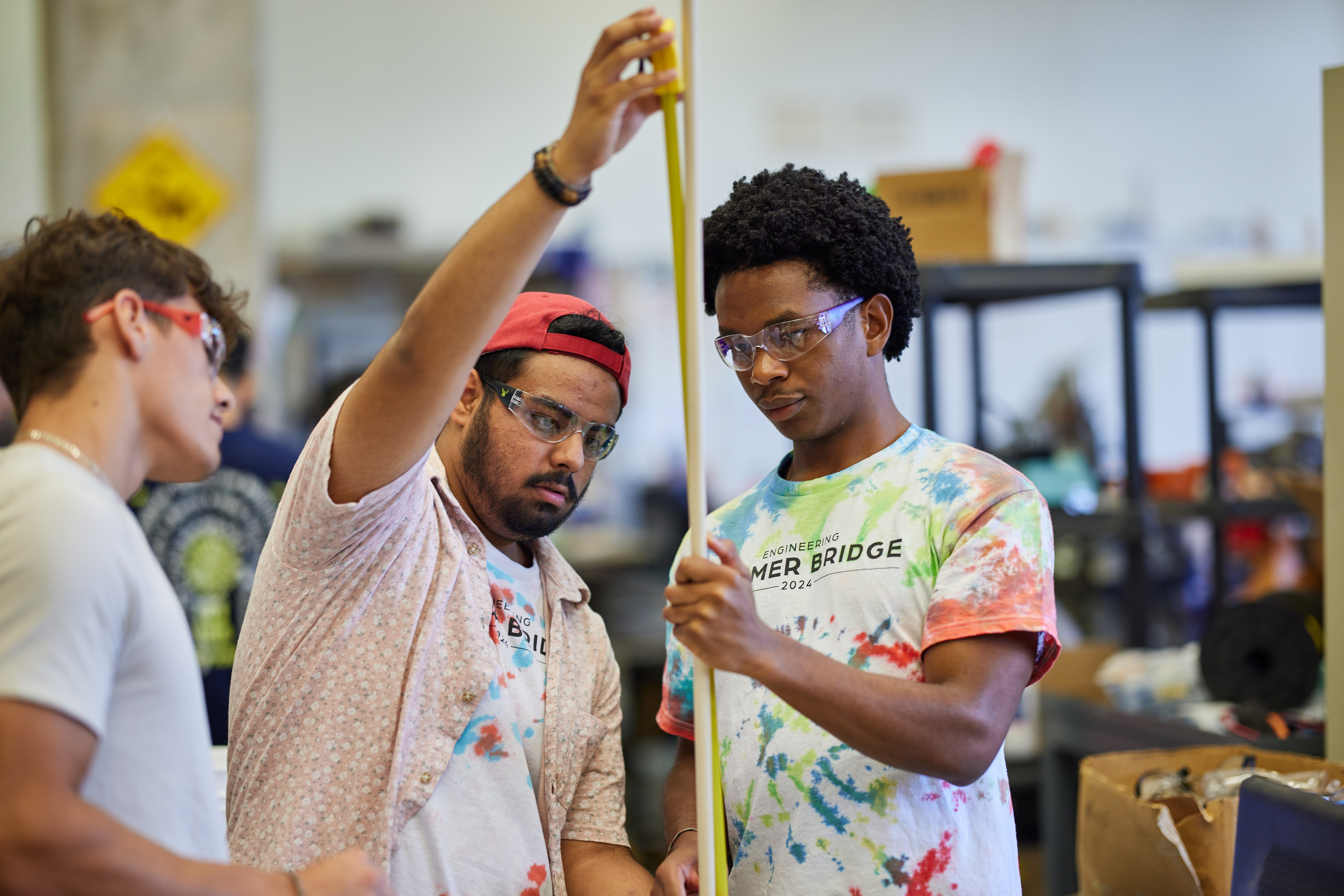 Three students working on engineering project