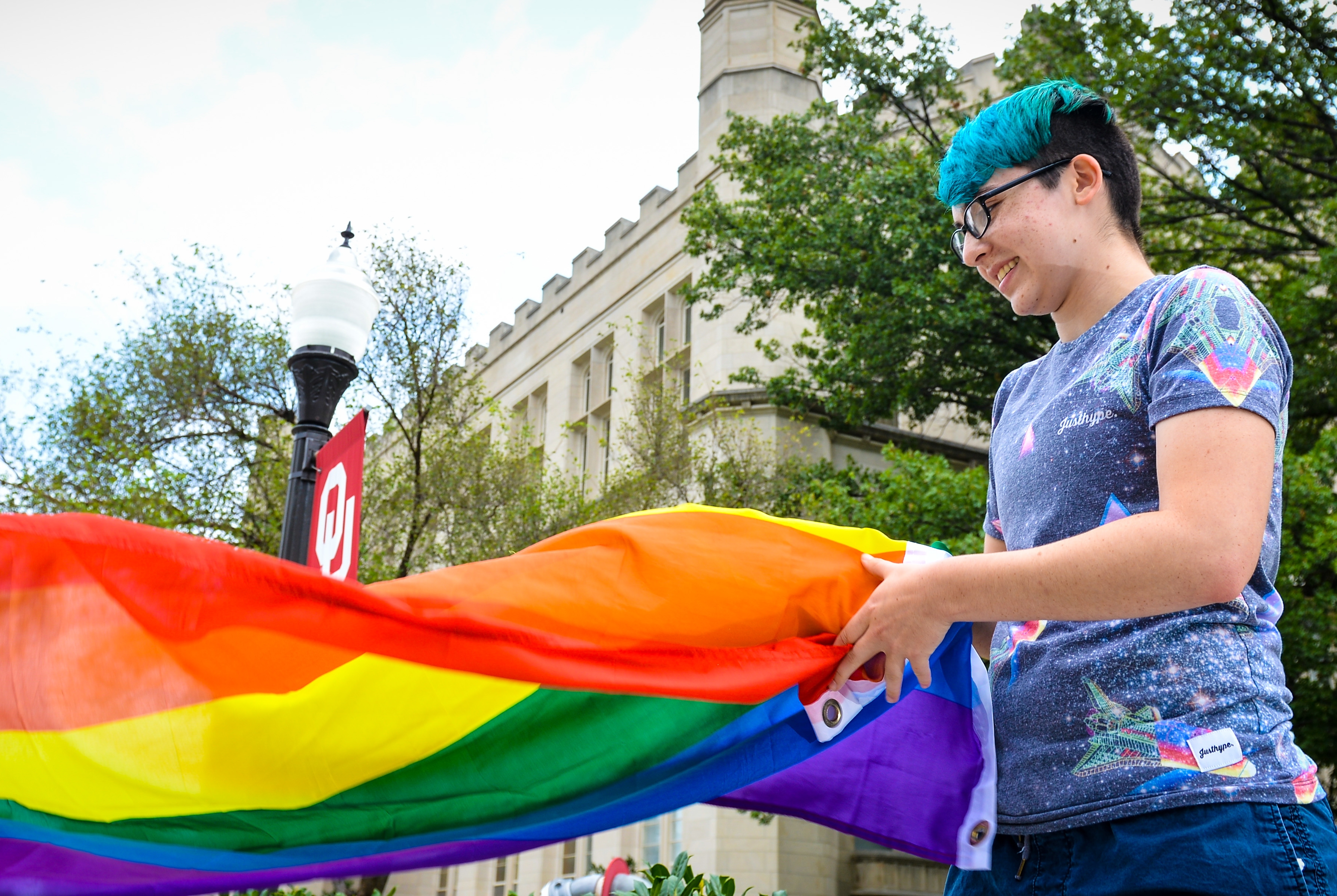 Student holding Pride Flag
