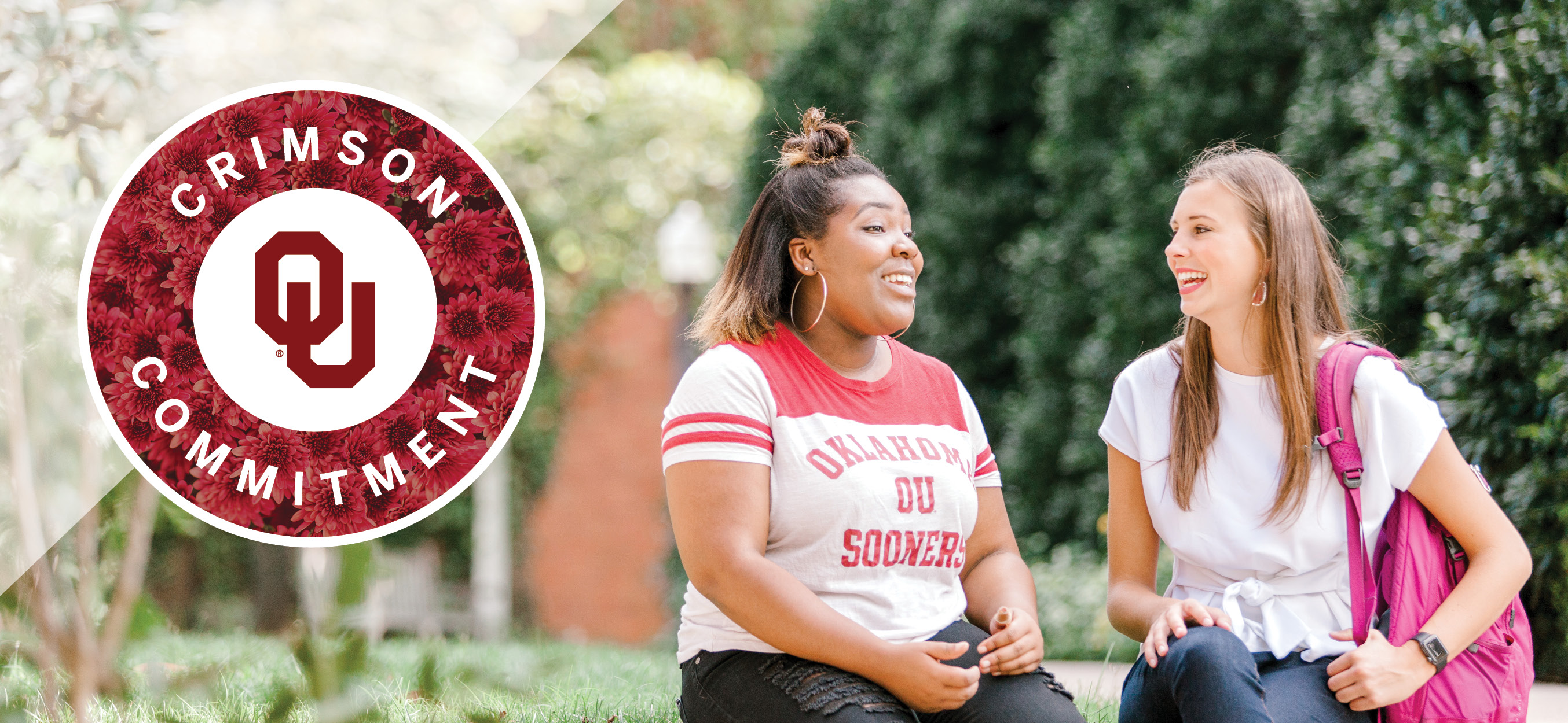 Crimson Commitment: Two students talking on OU campus