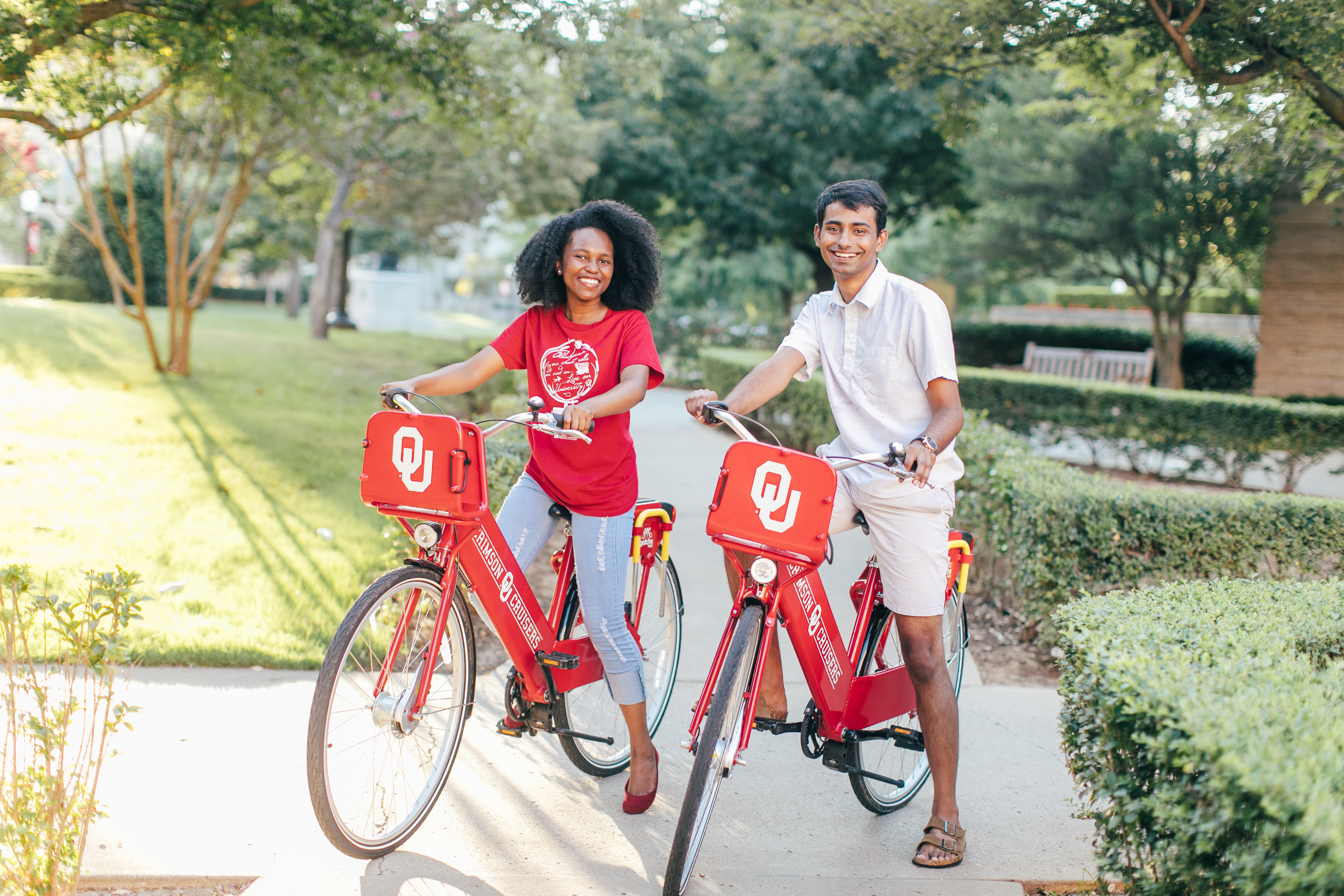 Students outside on OU bikes.