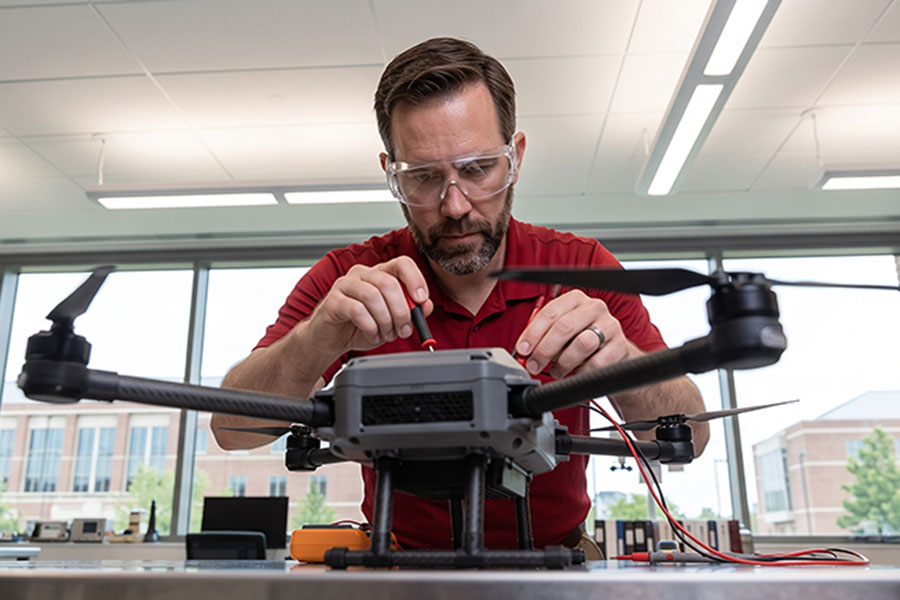 A person working on a drone.