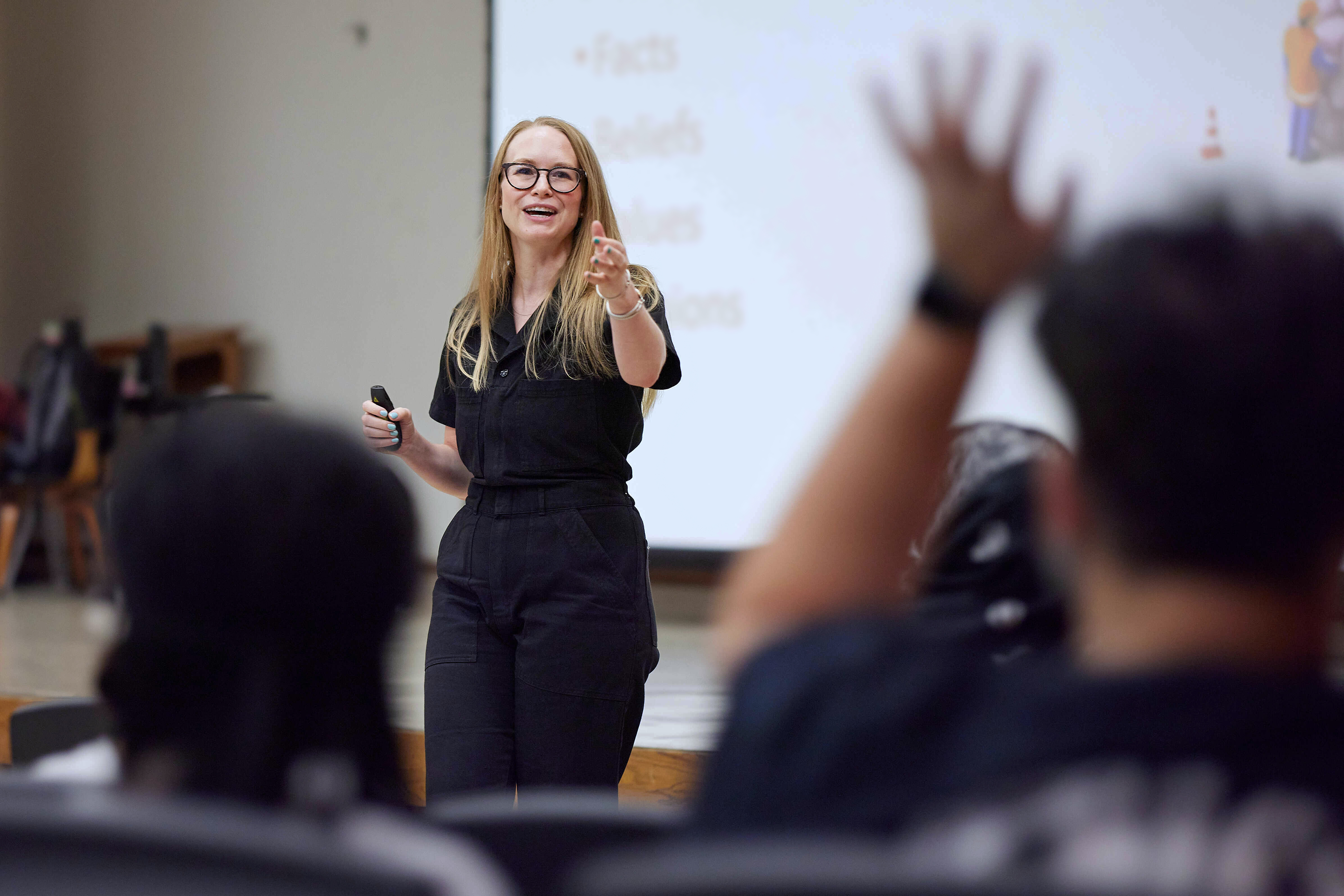 Professor standing at the front of a class.