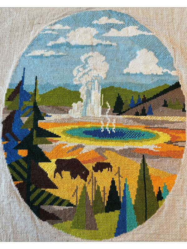 A stylized view of yellowstone gyster stitched in virbrant tones of blue, yellow, orange, and greens.