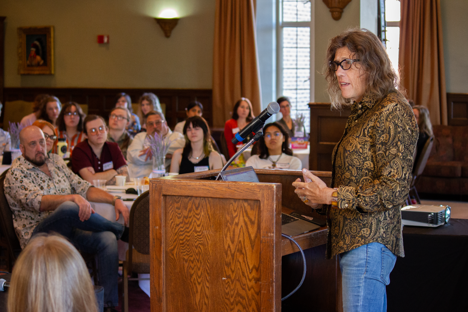 Dr. Susan Stryker talking to a room full of community members