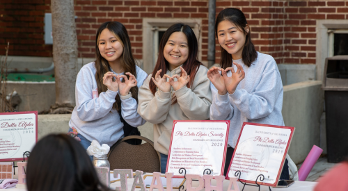 Sorority members pose for a group photo. 