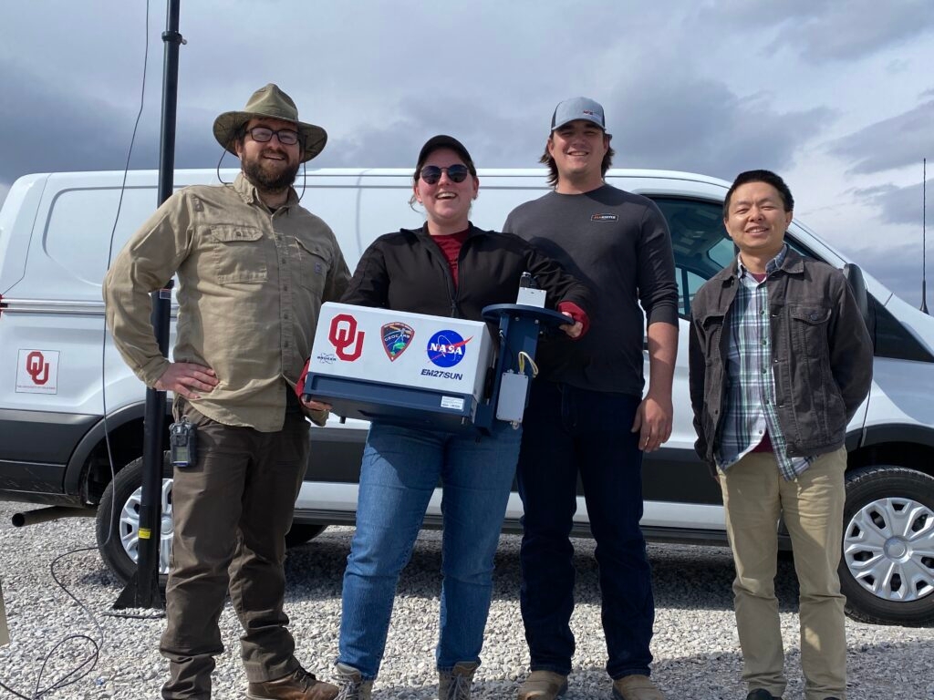 Xiao-ming-Hu, Wesley-Honeycutt-and-two-other-researchers-in-front-of-van-in-Pampas-Texas