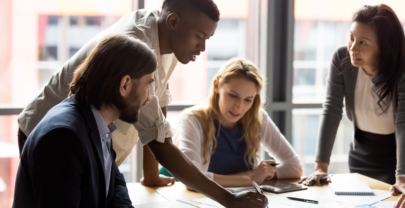 Four people working collaboratively