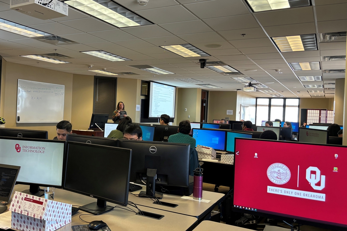  Dr. Heather Bedle, Assistant Professor in the School of Geosciences, guides participants through a series of exercises aimed at enhancing their practical skills in Python programming and basic natural language processing.