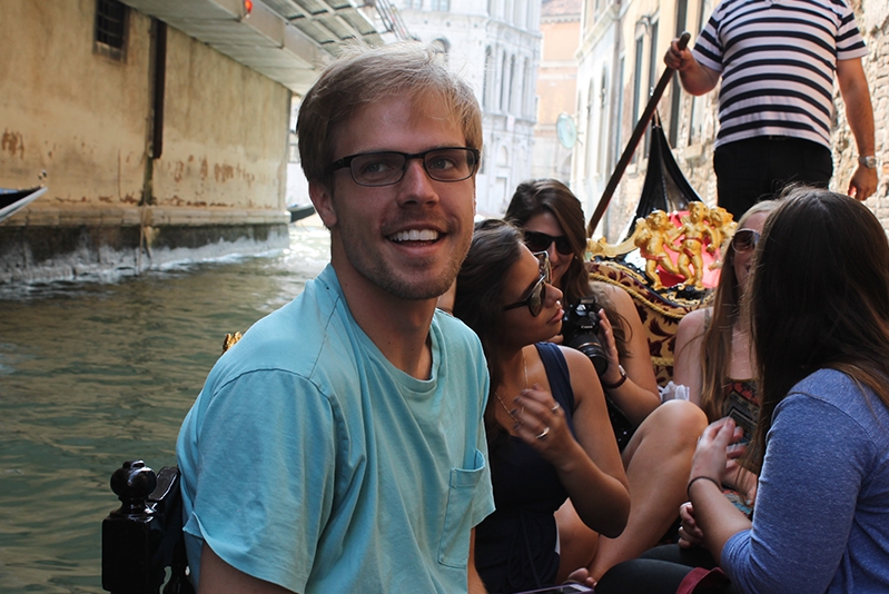 Student smiling on a gondola in Venice