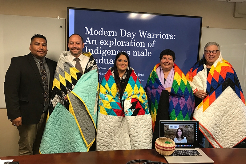 A group of educators attend a talk called "Modern Day Warriors"