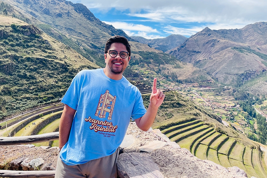 Juan Renteria holding up his index finger in Peru.