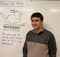 Nate DeAngelis standing at white board