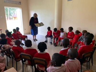 Professor Sally Beach reading to students.