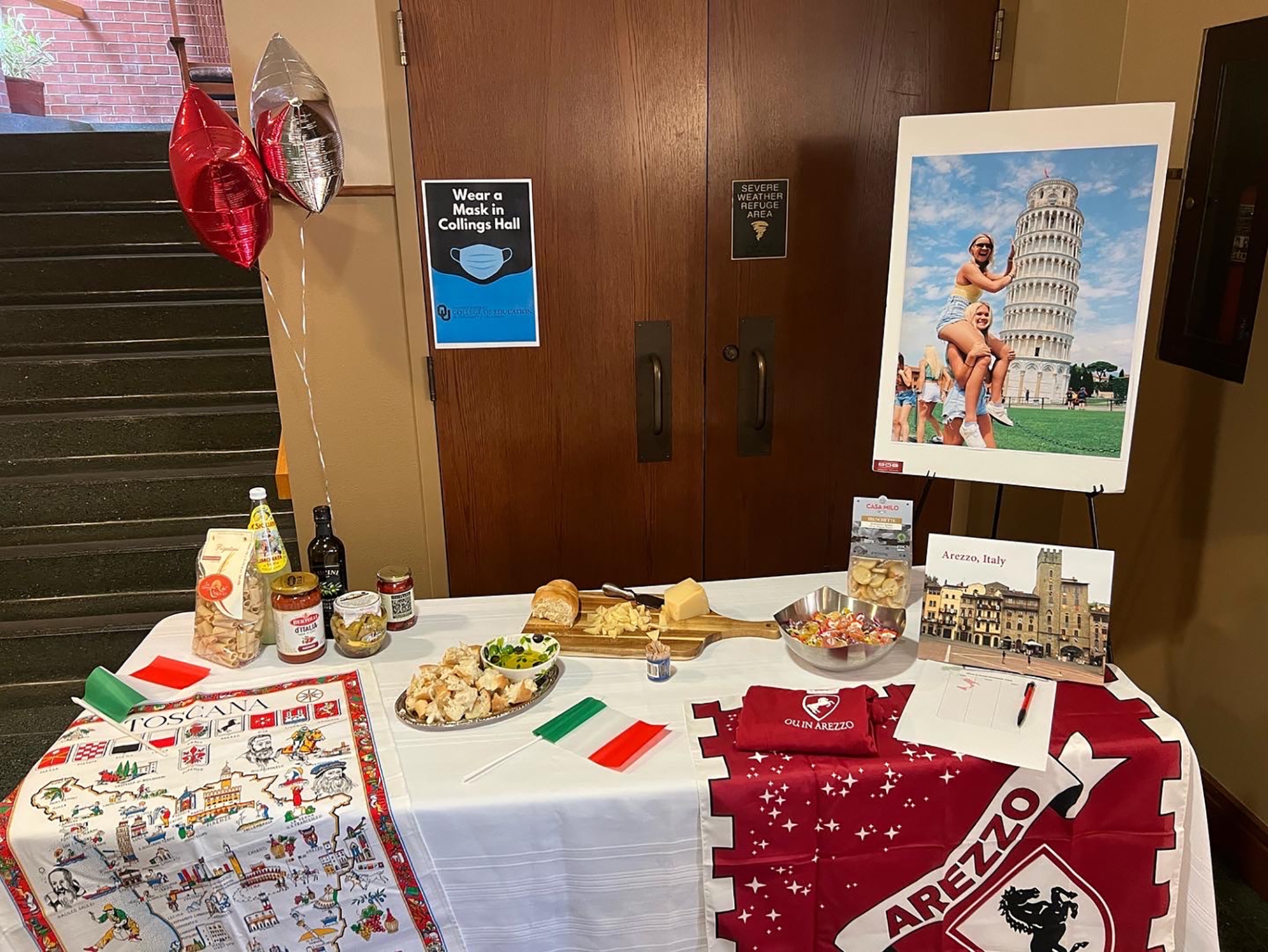 a table with Italian snacks and flags
