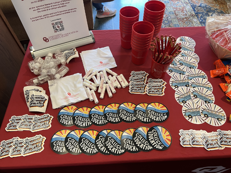 table full of JRCoE stickers, cups and chapstick