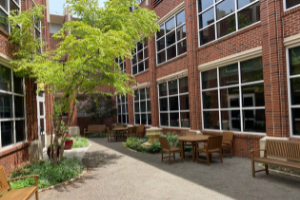 picture of JRCoE courtyard with trees and tables