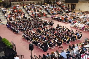 overhead view of students sitting in chairs at graduation
