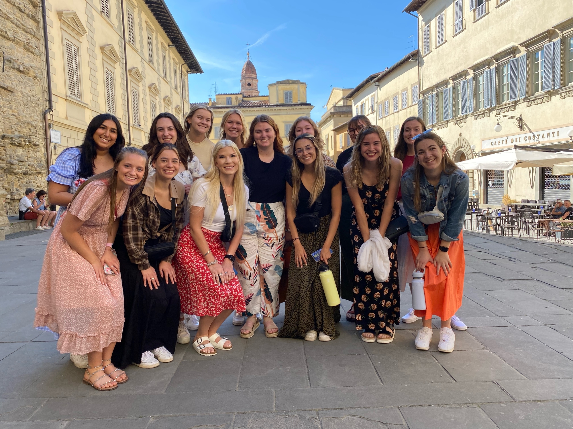 Students together in a group on an Italian piazza