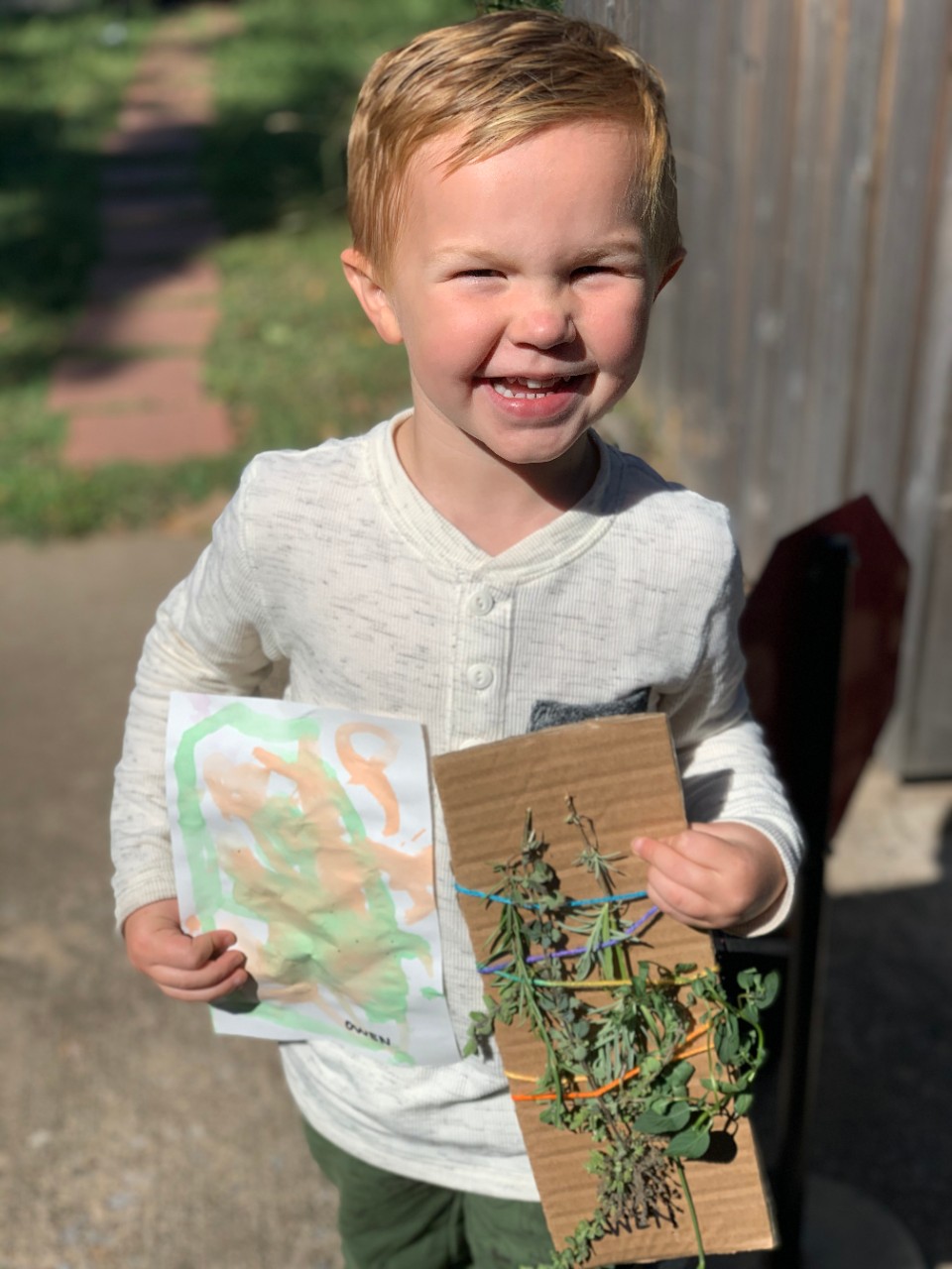 Child holding art project