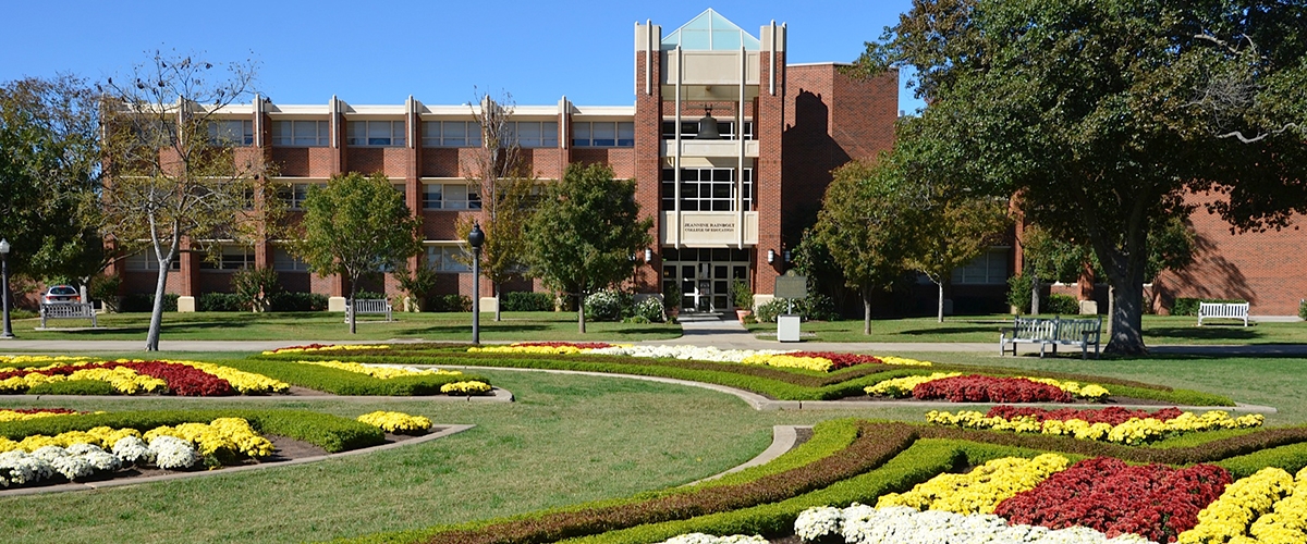 Jeannine Rainbolt College of Education at night.